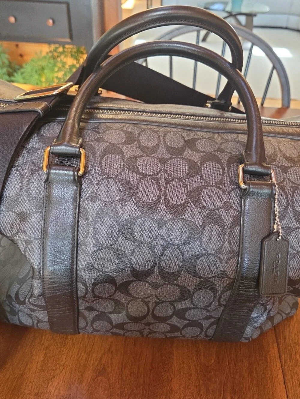 Coach Black Signature Leather Weekender tote bag dark gray and black.